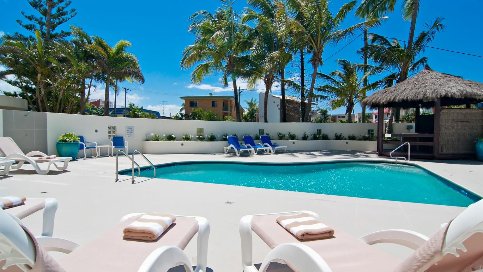 Daybeds by resort pool